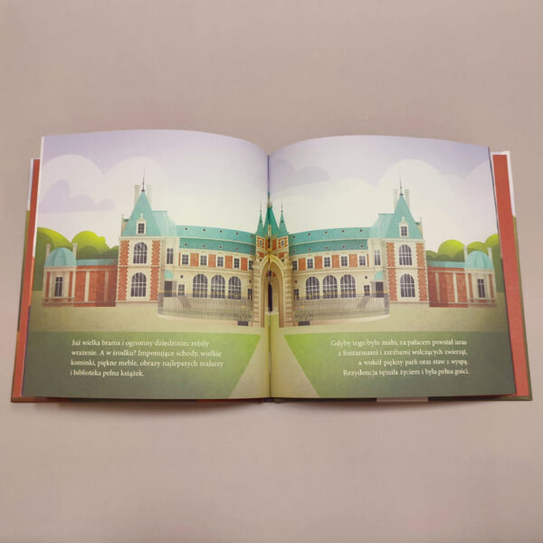 Otwarta książka z ilustacją, na której widac pałac w Świerklańcu.