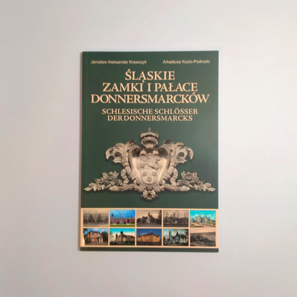 Okładka ksiązki z herbem Donnersmarcków i zdjęciami pałaców.